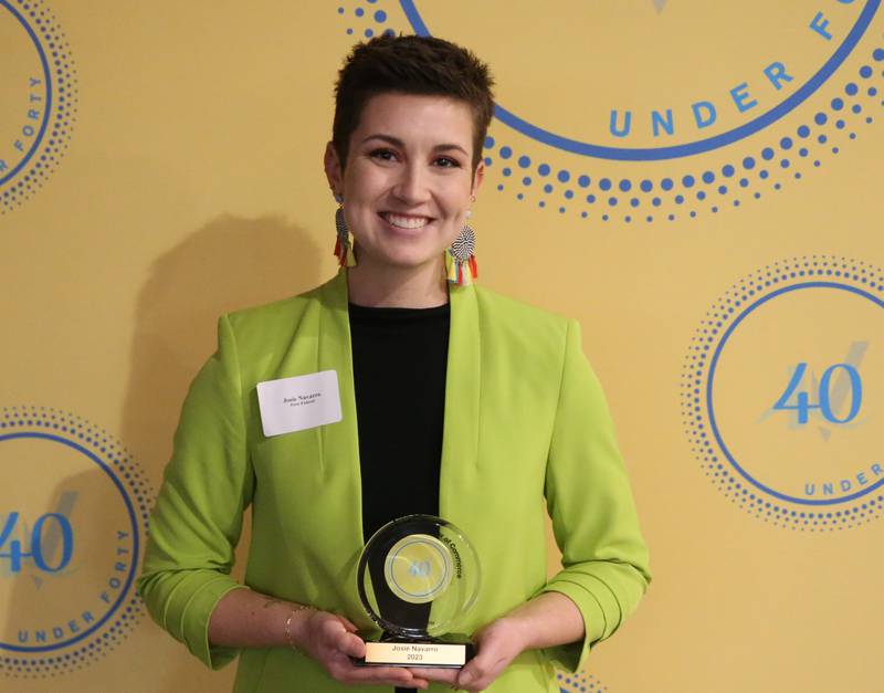 Josie Navarro poses for a photo with her award during the 40 Under Forty awards banquet on Thursday, March 21, 2024 at Westclox in Peru.