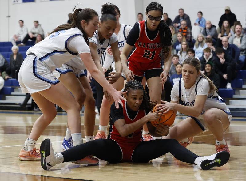 Bolingbrook's Sydney Dodd (4) is swarmed by the Nazareth defense for a loose ball during the girls varsity basketball game between Bolingbrook high school and Nazareth Academy on Monday, Jan. 12, 2026 in La Grange Park.