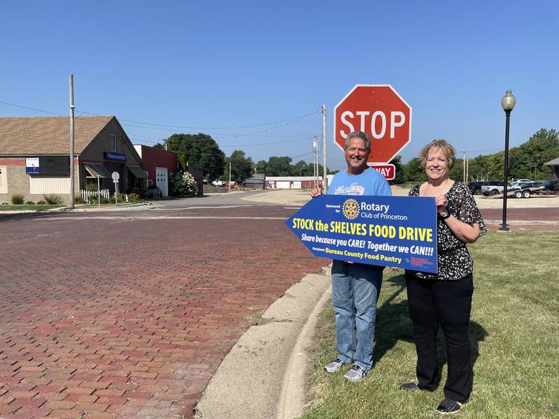 (Left to right); Princeton Rotary Club president Joe Park and director of the Bureau County Food Pantry Vaness Hoffeditz