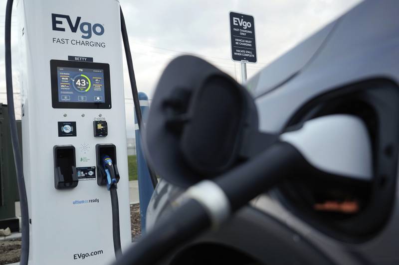 An electric vehicle charges at an EVgo fast charging station in Detroit, Wednesday, Nov. 16, 2022. (AP Photo/Paul Sancya)