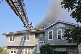 Fire crews battle rapidly spreading porch fire Sunday in Joliet