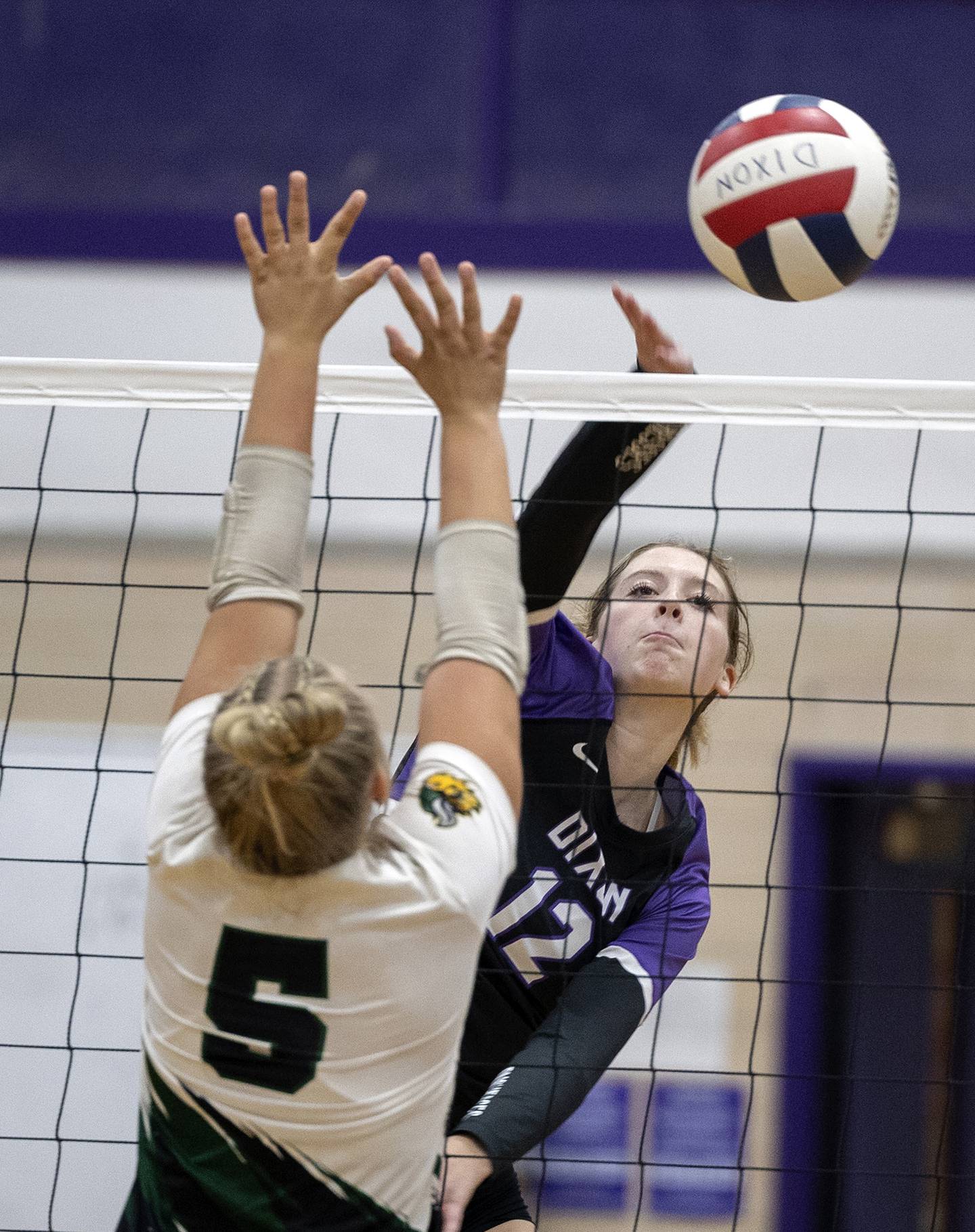 Dixon’s Isabelle Quackboerner hammers the ball against North Boone’ Tuesday, Sept. 24, 2024, in Dixon.