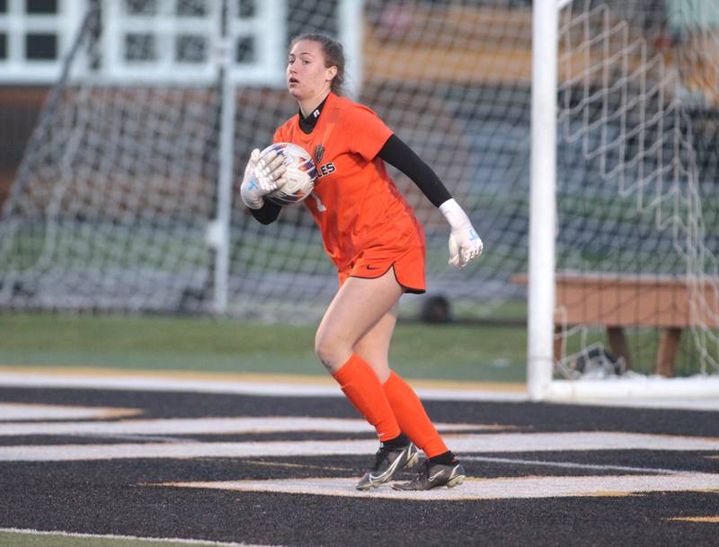 St. Charles East goalkeeper Sidney Lazenby makes a save during a game at Wheaton Warrenville South on Tuesday, April 18, 2023.