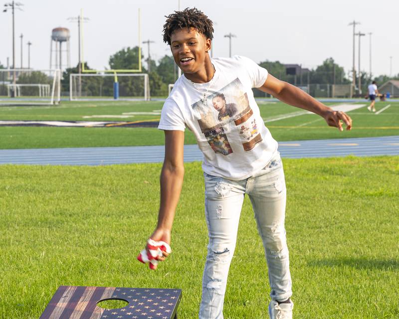 Joseph Hudson plays bags at the Joliet Police Department's National Night Out event Tuesday, Aug 5, 2025  in Joliet.