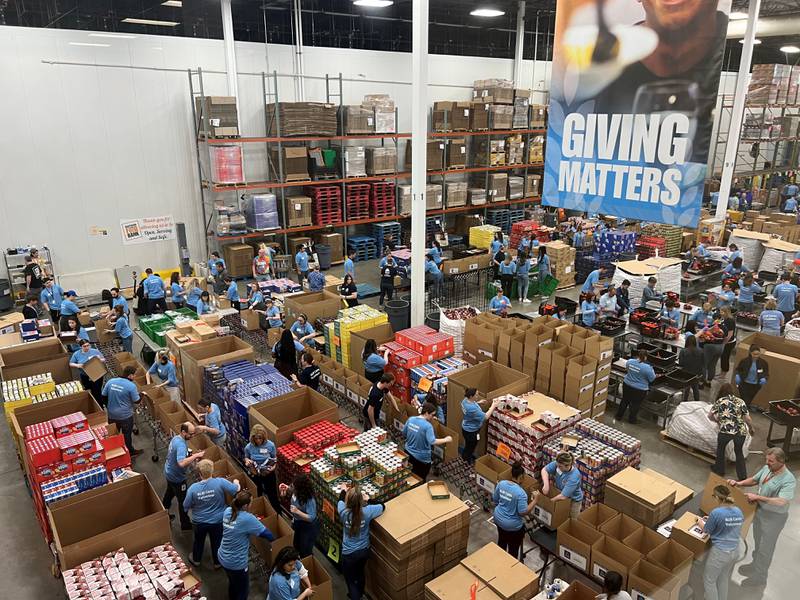 ALDI employees pack disaster relief boxes for Feeding America and the Northern Illinois Food Bank in Geneva, Illinois on May 9, 2023. Photo Credit: ALDI