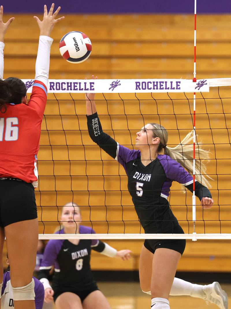 Dixon's Morgan Hargrave tries to tip the ball by Ottawa's Bella Knoll Tuesday, Oct. 28, 2025, during their Class 3A regional semifinal match at Rochelle High School.