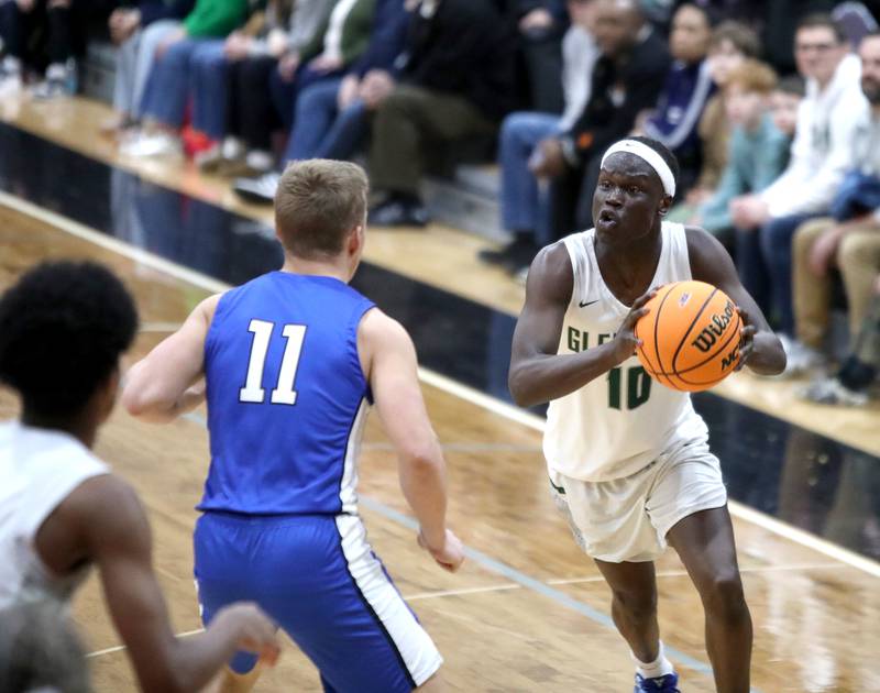 Glenbard West's Josh Abushanab looks for an opening during the Class 4A St. Charles East Sectional final against Geneva on Friday, March 7, 2025 in St. Charles.