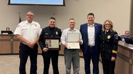 Morris police officer and civilian honored for saving a life on the Illinois River in August