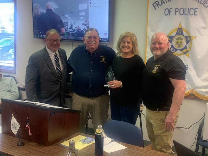 The Illinois Fraternal Order of Police recently recognized Carol Turney of Joliet and her "active and dedicated" support to the organization, a news release said. Pictured from left is Keith Turney, FOP awards chair Jerry Lieb, Carol Turney and FOP state lodge president Chris Southwood.