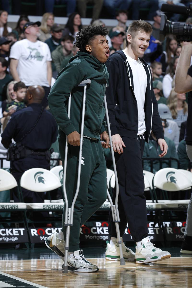 Michigan State guard Jeremy Fears Jr., left, and Michigan State forward Jaxon Kohler react near the bench during a game against Indiana State, Saturday, Dec. 30, 2023, in East Lansing, Mich.