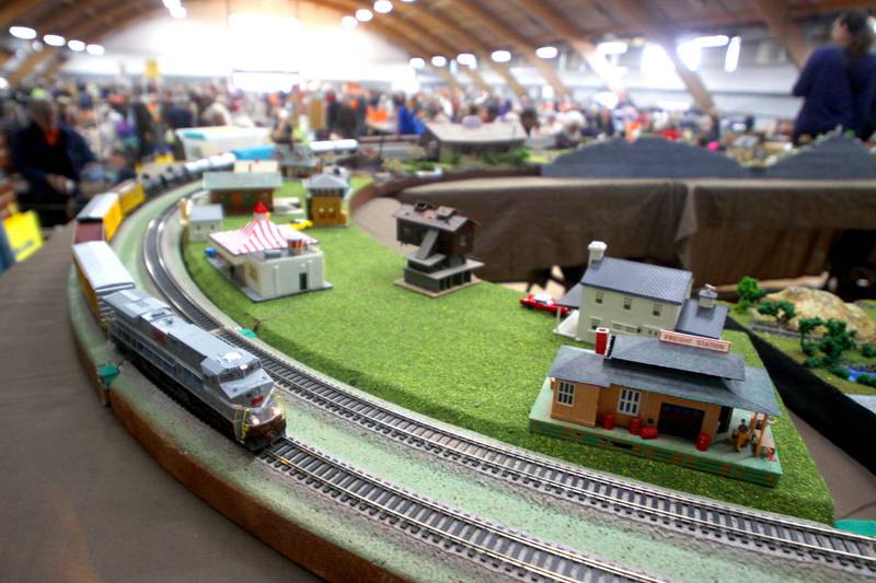 An HO-gauge train cruises the tracks on the main stage during the Great Midwest Train Show at the DuPage County Fairgrounds Sunday.