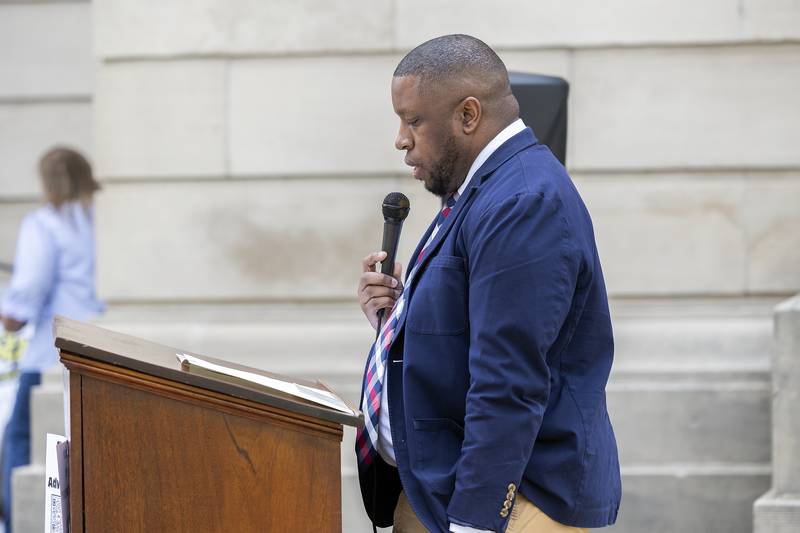 Dr. Aram Perry, Deputy Director of Child Protection for IDCFS, speaks during “Hands Around the Courthouse” in Dixon, Friday, April 25, 2025. April is child abuse prevention month.