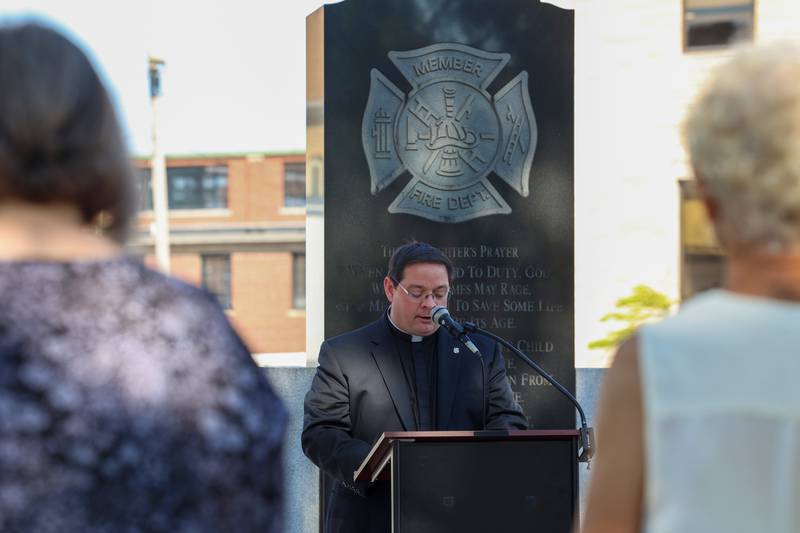 Father Matthew Pratscher, of St. John Paul II Catholic Church, gives an opening prayer. during the 44th Kankakee County Fallen Firefighter Memorial Service on Friday, Oct. 3, 2025.