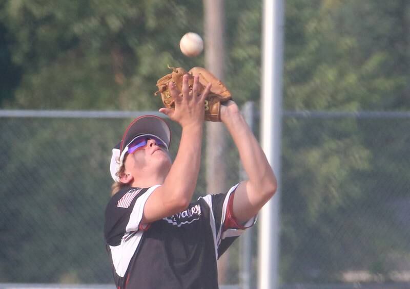 Spring Valley's Drew Carlson catches a pop fly on the infield while playing Michigan during the Central Region Baseball Tournament on Monday, July 24, 2023 at Washington Park in Peru.