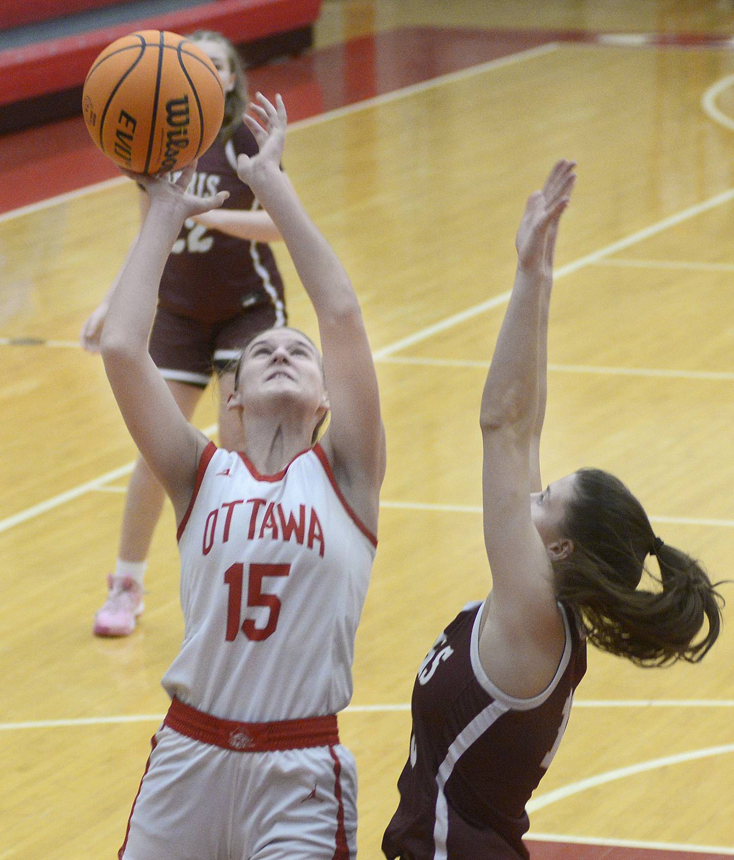 Ottawa’s Hailey Larsen shoots over the block attempt by Morris’s Tessa Shannon in the third period Saturday at Ottawa.