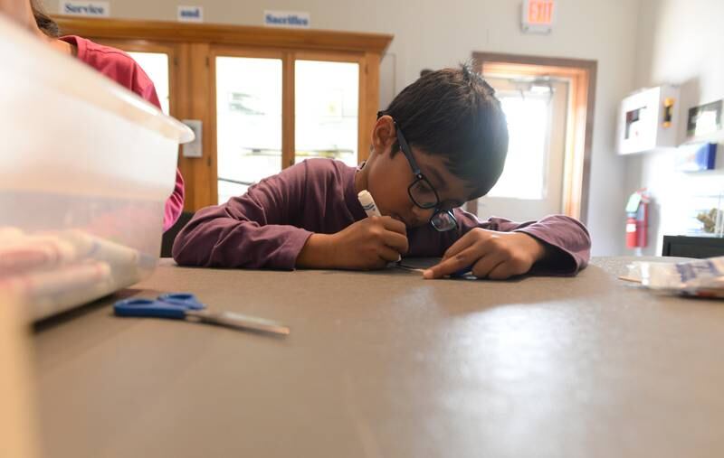 Children including Abyan Parvez of Rolling Meadows make crafts including Bubble Wands during Downers Grove Museum's Country in the Park  Saturday May 6, 2023.