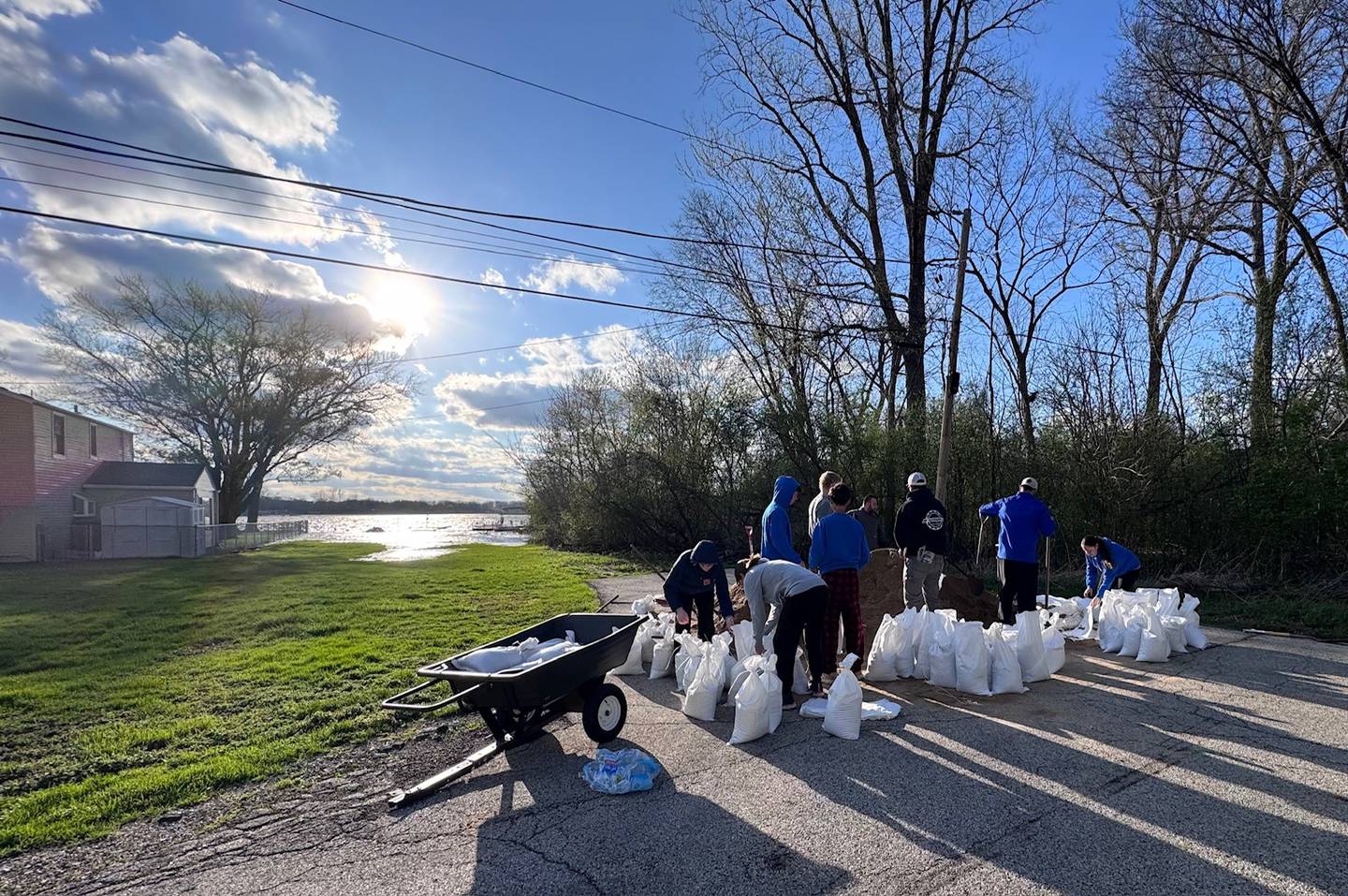 Johnsburg community comes out Saturday to help William Breit, 87, living on hospice in his home of 40 years, fill and stack sandbags as the river rises Saturday, April 18, 2026.