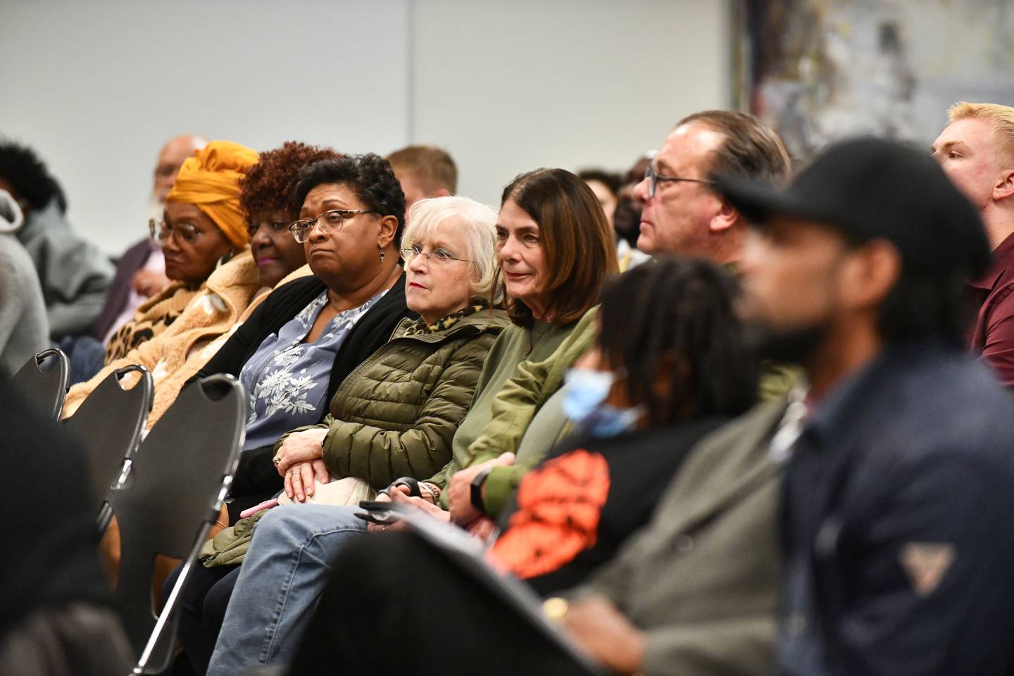 Attendees listen as Kankakee Mayor Chris Curtis and Democratic mayoral candidate Genevra Walters answer questions during the Kankakee County NAACP Candidates Forum on Tuesday, March 11, 2025, at Kankakee Community College.