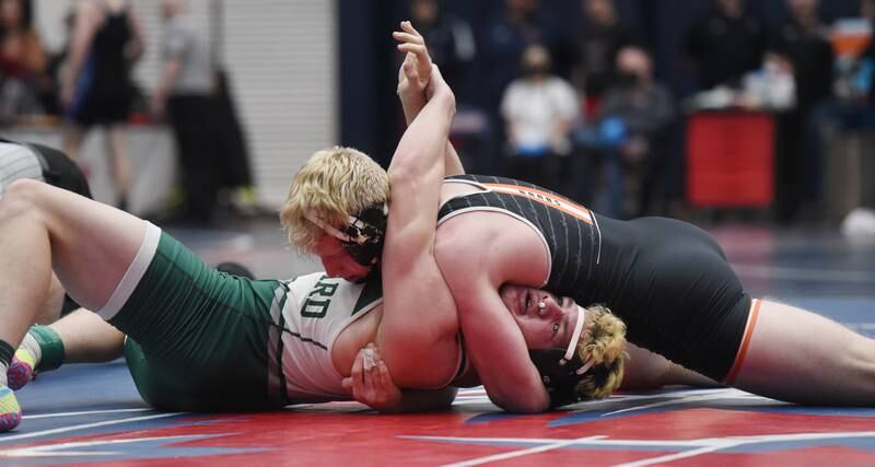 DeKalb's Bryson Buhk, top, pins Glenbard West's Philip Dozier in a 195-pound match during the semifinals of the Conant wrestling sectional in Hoffman Estates Saturday.
