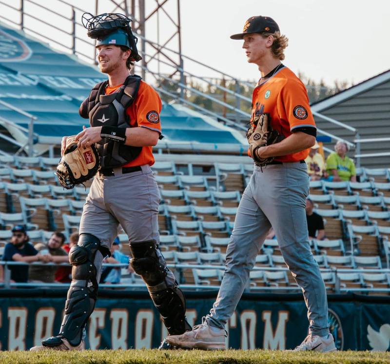 Nick Weaver (left) and Jackson Peeler walk off the field during the Illinois Valley Pistol Shrimp's 11-6 loss to the Springfield Lucky Horseshoes on Friday, July 26, 2024 in Springfield.