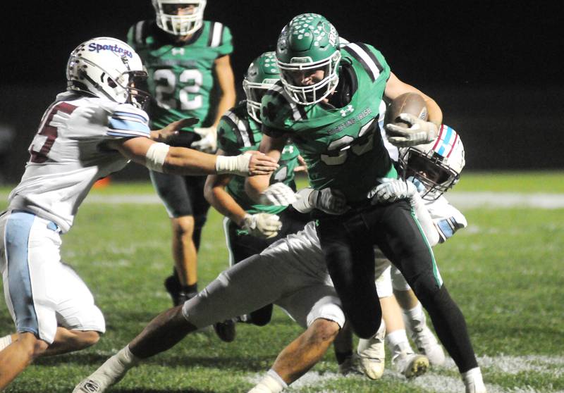 Seneca's Cam Shriey (33) struggles for yardage against St. Joe-Ogden on Friday, Oct. 17, 2025 at Seneca High School.