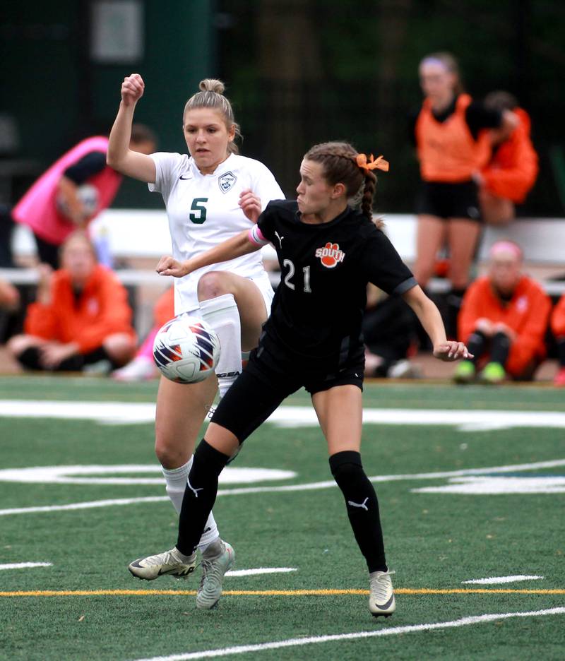 Glenbard West's Hannah Michalowski and Wheaton Warrenville South's Ashlyn Adams go after the ball during a Class 3A Glenbard West Sectional semifinal game on Tuesday, May 27, 2025 in Glen Ellyn.