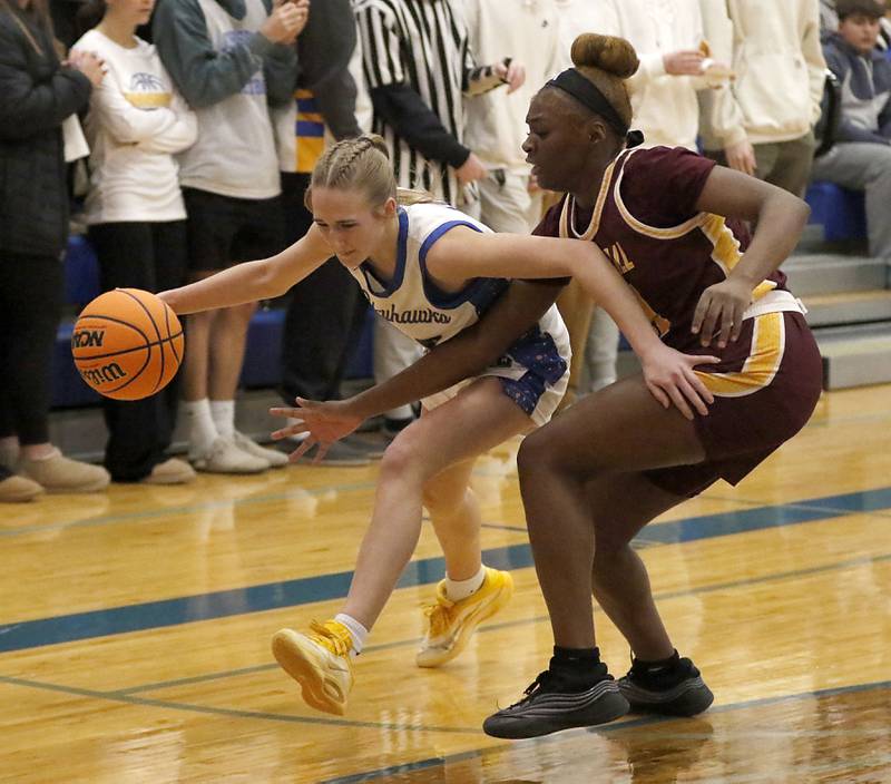 Johnsburg's Addison Sweetwood tries to drive the baseline against Chicago Marshall's Alysha Murphy during a IHSA Class 2A Johnsburg Sectional girls basketball semifinal game on Tuesday, February, 24, 2026, at Johnsburg High School.