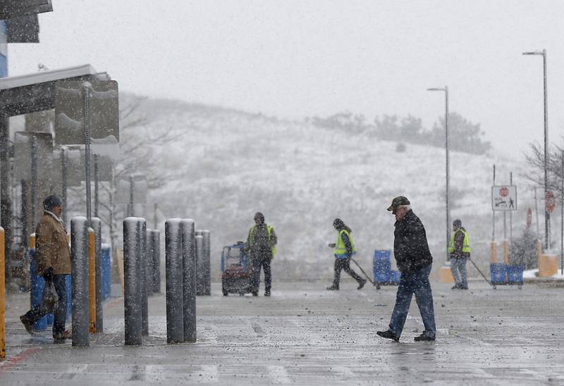 Shoppers walks into the Johnsburg Walmart on Tuesday, Nov. 15, 2022. The McHenry County area received its first measurable snowfall of the season on Tuesday.