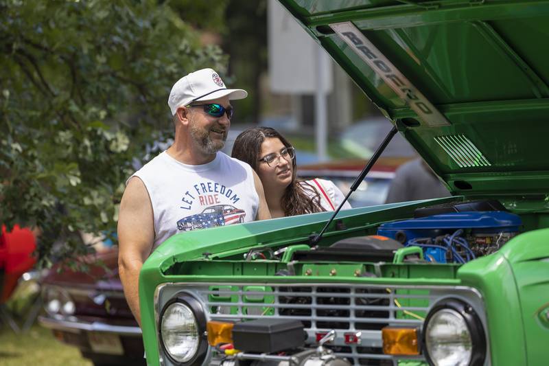 Benny and Saida Bajrami look over a vintage Bronco Friday, July 4, 2025, at the Petunia Fest car show.