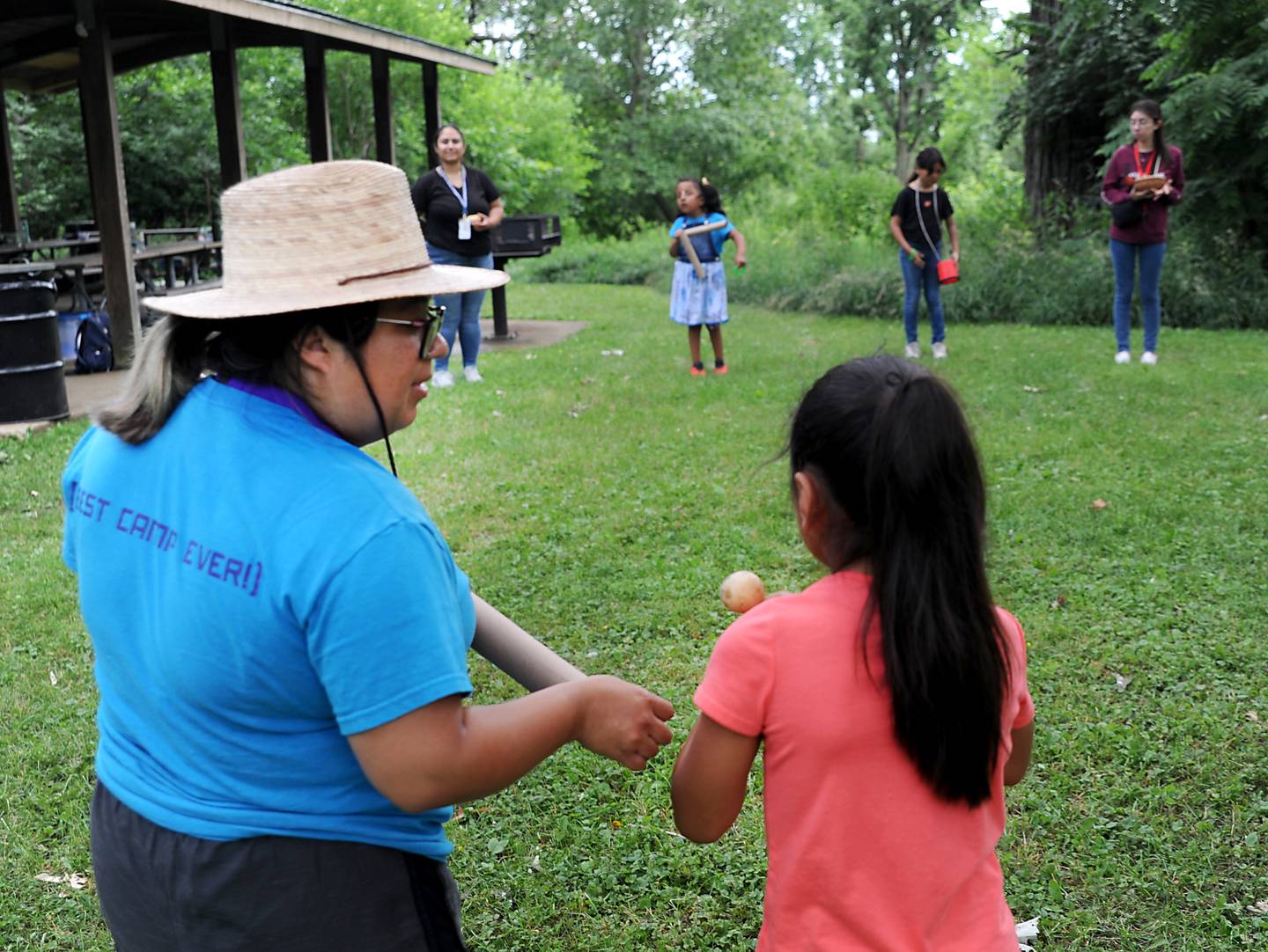 Carmen Cruz listens to Alondra Quinones as they share their feelings in a final drum circle during a field trip Wednesday, July 6, 2022, to the Harrison Benwell Conservation Area, 7055 McCullom Lake Road in Wonder Lake. The Youth and Family Center of McHenry County is hiring a social worker to assist with the mental health needs of those they help. The nonprofit is one of three receiving funds through United Way of Greater McHenry County as part of an Advance McHenry County grant.