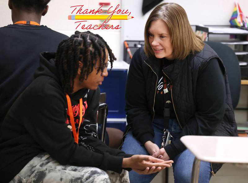 Jenni Smith, an eighth grade math teacher at Huntley Middle School, talks to a student Wednesday, March 19, 2025, in her class at the school in DeKalb.