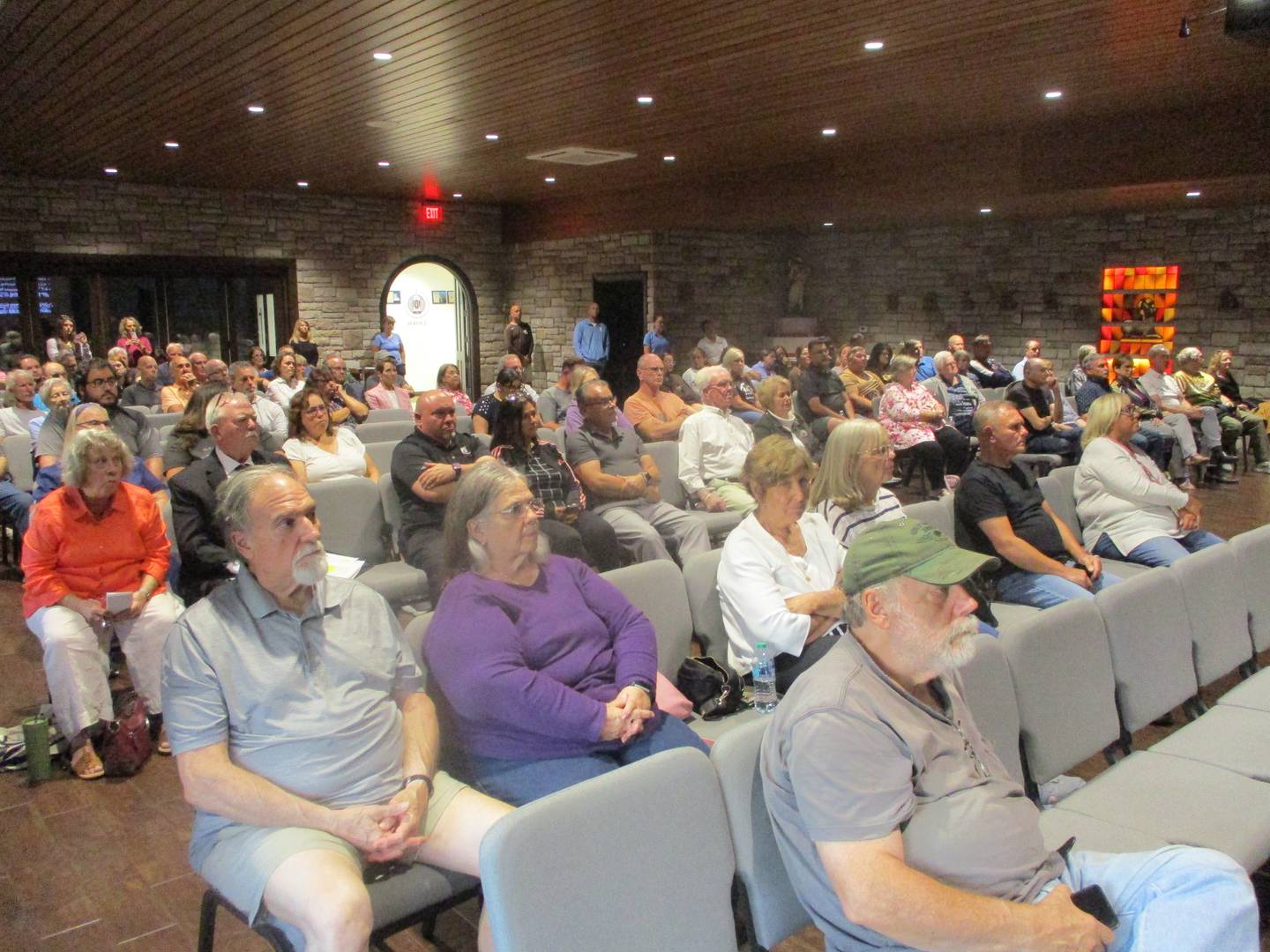 About 100 people attended a community meeting at Joliet Catholic Academy on Wednesday to hear school officials outline their plans for new athletic fields including an on-campus football stadium. Sept. 24, 2025