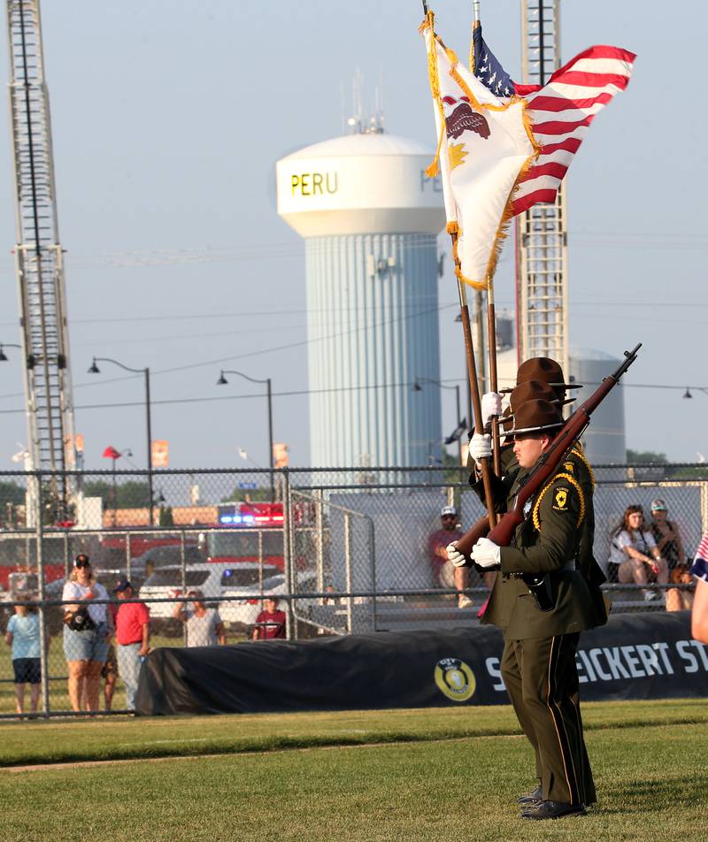 Members of the Illinois State Police honor guard present the Colors during First Responder night at the Illinois Valley Pistol Shrimp baseball game at Schweickert Stadium on Tuesday, June 20, 2023 in Peru.