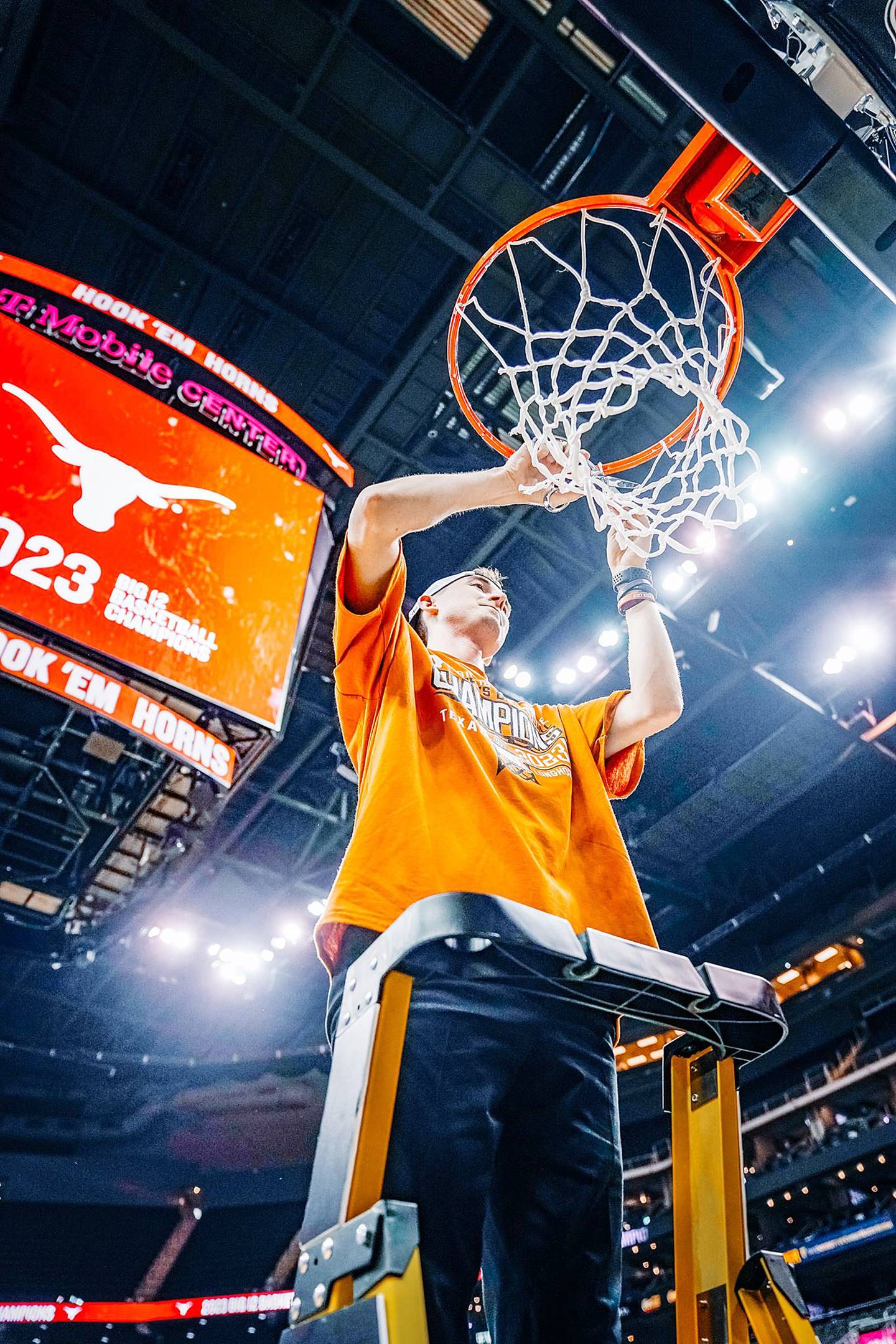 Rock Falls native KJ Conklin cuts down the net after the Texas Longhorns won the Big 12 Tournament championship last season at the T-Mobile Center in Kansas City. Conklin is on the men's basketball staff at Texas.