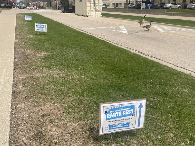 Signage is seen Saturday, April 11, 2026, outside NIU's Founders Memorial Library in DeKalb, directing passersby to check out DeKalb County Earth Fest.