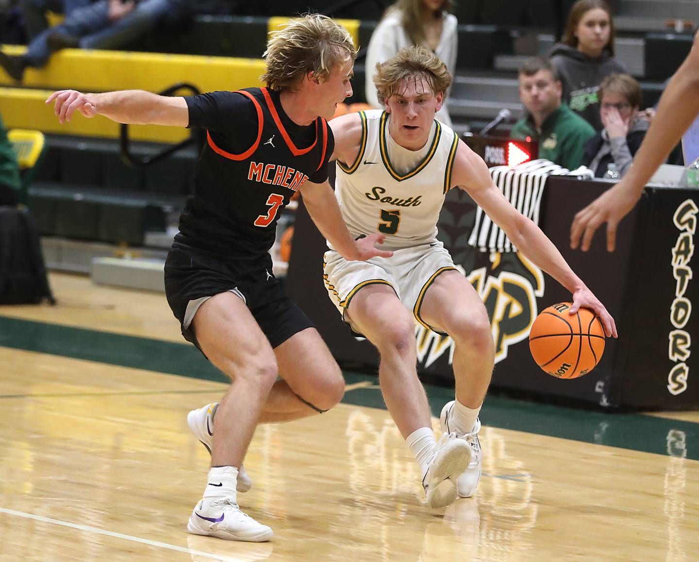 Crystal Lake South's Carson Trivellini brings the ball up the court again McHenry's Dane Currie during a Fox Valley Conference boys basketball game on Wednesday, Jan. 14, 2026, at Crystal Lake South High School.