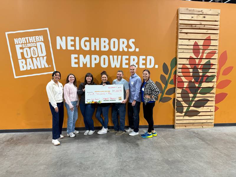 A group of Logical Position employees recently delivered a $4,000 check to the Northern Illinois Food Bank.