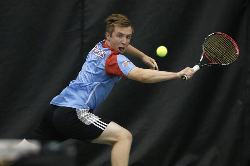 Marian Central’s Patrick Kumm tries to return the ball during a IHSA 1A boys double tennis match Thursday, May 26, 2022, at Midtown Athletic Club in Palatine.
