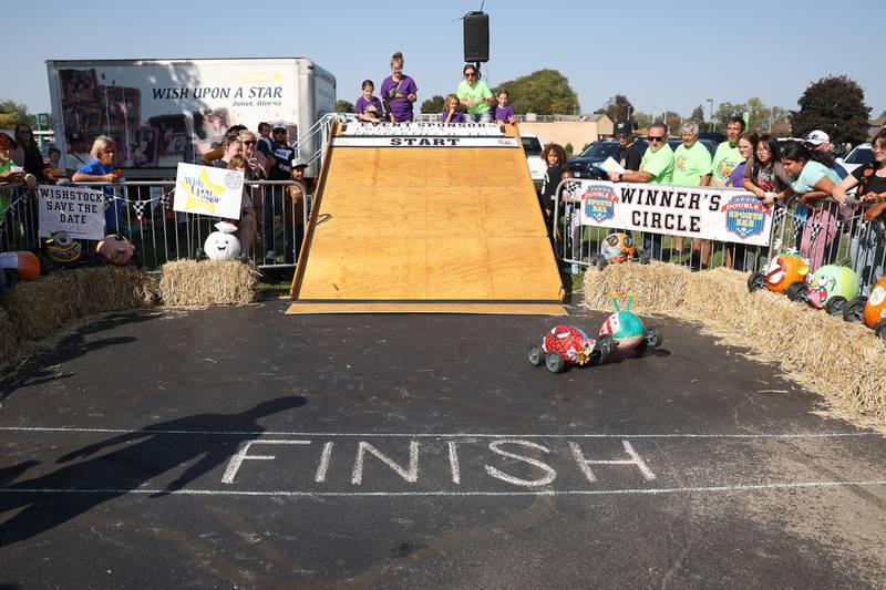 Pumpkin Spiderman beats out Gary, the pumpkin snail in the Pumpkin Derby at the Wish Upon a Star fundraiser on Saturday, Oct. 5, 2024 in Joliet.