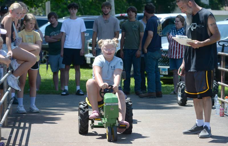 Emily Grimes, 8, of Hooppole, competes in the pedal tractor pull at Hooppole Fun Day on Saturday, June 28, 2025.