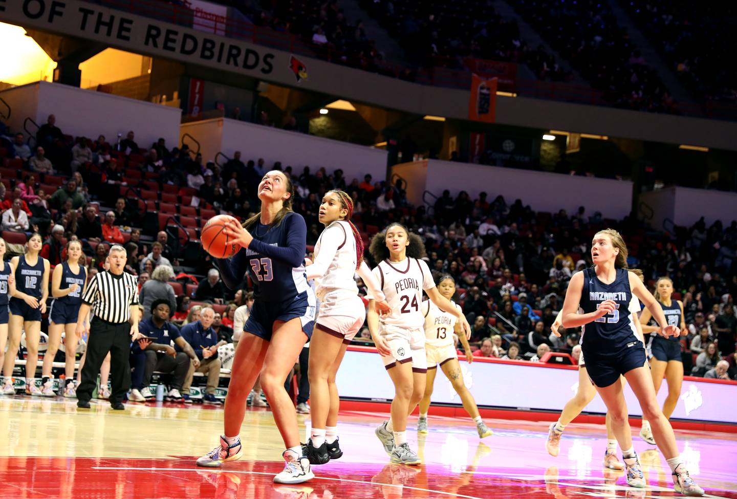Nazareth Academy's Danielle Scully (23) looks for her shot from under the basket during the Class 3A girls basketball state semifinal against Peoria at Redbird Arena in Normal on Friday, March 3, 2023.