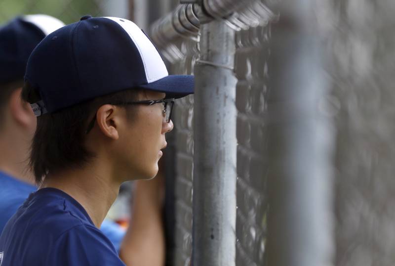 Beisebol’s Vitor Icharo watches his teammates bat during the opening round of the Under 13 McHenry County Youth Sports Association’s Summer International Championship baseball tournament on Friday, July 11, 2025, at the Mickey Sund Baseball Complex in Crystal Lake's Lippold Park.