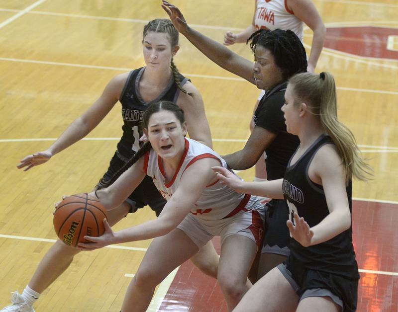 Ottawa’s Mary Stisser is surrounded by the Kaneland defense after bring down a rebound in the 1st quarter Wednesday at Ottawa.