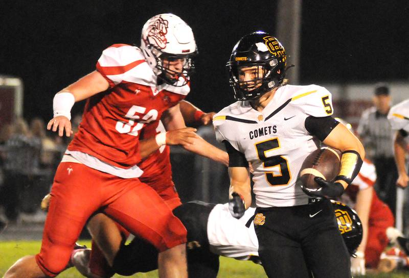 Reed-Custer's Brandon Moorman (5) tried to evade Streator's Brant Freese (52) at the SHS Athletic Fields on Friday, Oct. 8, 2021.