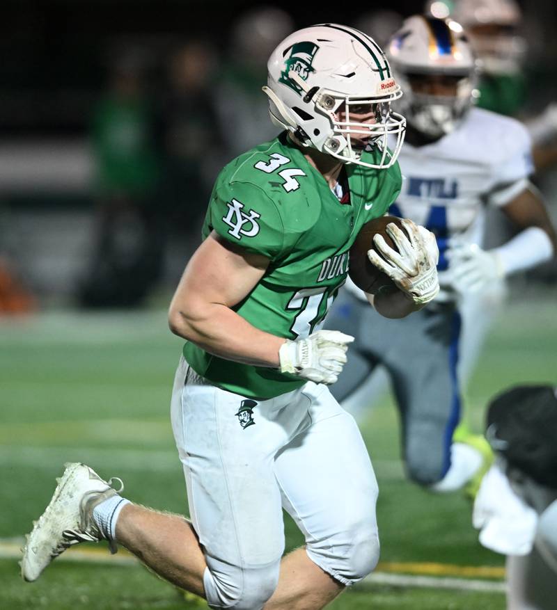 York’s Jimmy Conners carries the ball against Warren during a Class 8A football quarterfinal on Friday, Nov. 15, 2024 in Elmhurst.