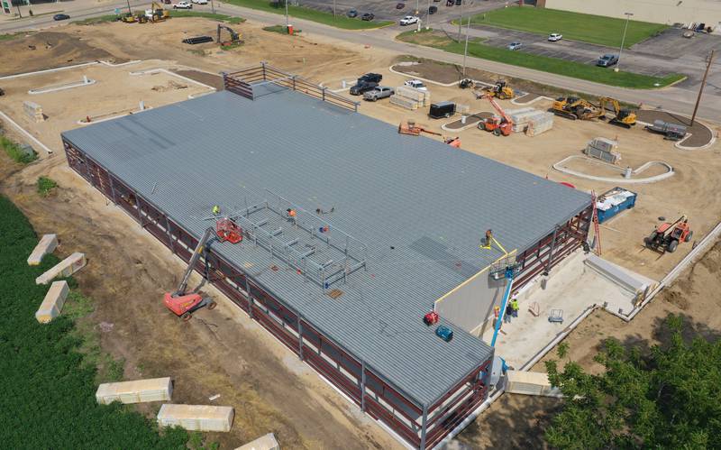 Crews continue to construct an Aldi grocery store on Tuesday, Aug. 13, 2025 at the intersection of Backbone Road and North Main Street in Princeton. Workers are beginning to build the exterior walls this week. The 20,000 square-foot store could be open by Thanksgiving.