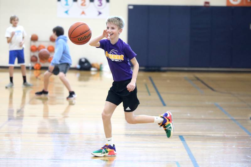 Henry Achilles, 11, plays basketball during the Downers Grove Park District Recreation Center on Thursday, Jan. 4, 2024.