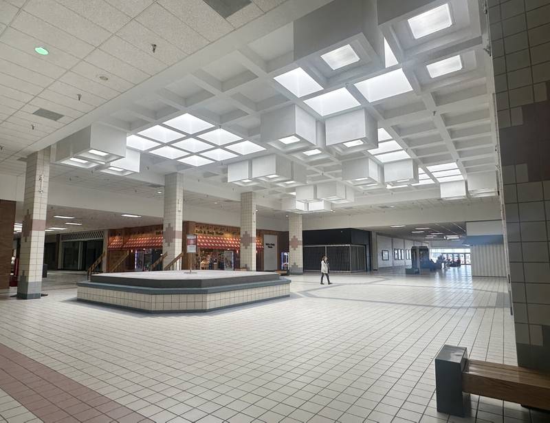 A person walks near the center court area inside the Peru Mall on Tuesday, March 9, 2024 in Peru. The mall turns 50 years old this year.