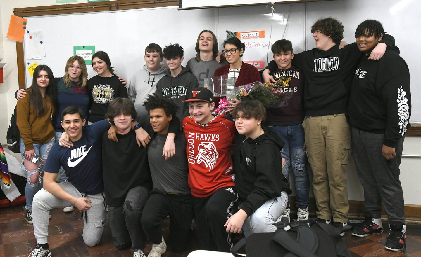 Oregon High School teacher Kimberly Radostits poses with some of her students after receiving the award for being chosen 2022 Illinois Teacher of the Year. Officials surprised Radostits with the announcement in her classroom on Tuesday morning.