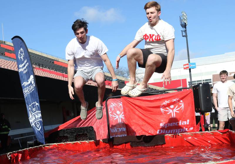 Members of the Phi Kappa Psi fraternity jump into the water on a cold and windy Saturday, Feb 17, 2024, during the Huskie Stadium Polar Plunge at Northern Illinois University in DeKalb. The Polar Plunge is the signature fundraiser for Special Olympics Illinois.